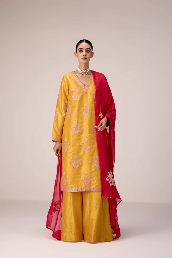 Mustard pink gold patch and thread embroidered kurta pants set.
